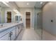 Elegant bathroom with dual vanity, walk-in shower, and modern fixtures at 11707 Hatchling Ave, Las Vegas, NV 89138