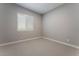Simple bedroom with window shutters and neutral wall tones at 11707 Hatchling Ave, Las Vegas, NV 89138