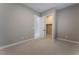 Well-lit bedroom with a closet and access to another room at 11707 Hatchling Ave, Las Vegas, NV 89138