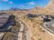 Aerial view of community with a trail and desert landscape at 11707 Hatchling Ave, Las Vegas, NV 89138