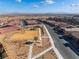 Aerial view of community showing homes, park, and distant city view at 11707 Hatchling Ave, Las Vegas, NV 89138