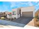 Modern home with two-car garage and landscaped front yard at 11707 Hatchling Ave, Las Vegas, NV 89138