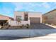 Modern home with two-car garage and landscaped front yard at 11707 Hatchling Ave, Las Vegas, NV 89138