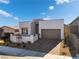 Modern single-story home with attached garage and landscaped yard at 11707 Hatchling Ave, Las Vegas, NV 89138