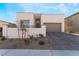 Single-story home with modern facade, two-car garage, and landscaped front yard at 11707 Hatchling Ave, Las Vegas, NV 89138