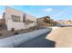 Contemporary stucco home with modern lines and landscaping at 11707 Hatchling Ave, Las Vegas, NV 89138
