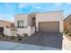 Single-story home with modern facade and two-car garage at 11707 Hatchling Ave, Las Vegas, NV 89138