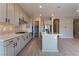 Modern kitchen with stainless steel appliances and an eat-in island at 11707 Hatchling Ave, Las Vegas, NV 89138