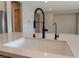 Modern kitchen sink with a sleek, black gooseneck faucet at 11707 Hatchling Ave, Las Vegas, NV 89138