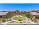 Aerial view of a community with houses, landscaping, and a central lawn area at 1359 Skylight Way, Mesquite, NV 89034