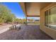 Covered patio with brick pavers, seating area, and mountain views at 1359 Skylight Way, Mesquite, NV 89034