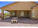 Covered patio with brick pavers and a seating area at 1359 Skylight Way, Mesquite, NV 89034