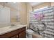 Clean bathroom with single sink vanity, toilet, and shower/tub combo at 1359 Skylight Way, Mesquite, NV 89034