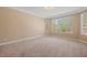Spacious bedroom with neutral carpeting and large windows at 1359 Skylight Way, Mesquite, NV 89034