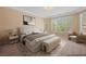 Spacious bedroom with large windows and plush bedding at 1359 Skylight Way, Mesquite, NV 89034