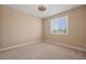 Spacious bedroom with neutral walls, carpet, and large window at 1359 Skylight Way, Mesquite, NV 89034