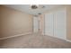 Bright bedroom with double-door closet and neutral colored carpet at 1359 Skylight Way, Mesquite, NV 89034