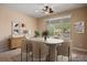 Virtually staged dining room with modern furniture at 1359 Skylight Way, Mesquite, NV 89034