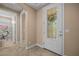 Spacious entryway with tile flooring, an interior door, and access to a bathroom at 1359 Skylight Way, Mesquite, NV 89034