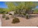 One-story home with tan exterior, two-car garage, and desert landscaping at 1359 Skylight Way, Mesquite, NV 89034