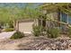 Landscaped front yard with drought-tolerant plants and a paved driveway at 1359 Skylight Way, Mesquite, NV 89034
