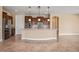 Open kitchen with dark wood cabinets and granite counters at 1359 Skylight Way, Mesquite, NV 89034