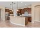Open kitchen with dark wood cabinets and granite counters at 1359 Skylight Way, Mesquite, NV 89034