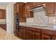 Modern kitchen with stainless steel appliances and granite countertops at 1359 Skylight Way, Mesquite, NV 89034