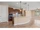 Open kitchen with dark wood cabinets and granite counters at 1359 Skylight Way, Mesquite, NV 89034