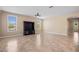 Bright living room with tile floors and large windows at 1359 Skylight Way, Mesquite, NV 89034