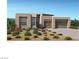 Modern home with two-car garage and desert landscaping at 157 Tre Pietre St, Henderson, NV 89011