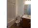 Clean bathroom with a tub, toilet and vanity at 1706 Pondering Ave, North Las Vegas, NV 89031