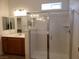 Bathroom with walk-in shower and double vanity at 1706 Pondering Ave, North Las Vegas, NV 89031