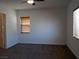 Spacious bedroom with two windows and ceiling fan at 1706 Pondering Ave, North Las Vegas, NV 89031