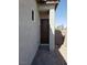Side entrance with a walkway and brick pavers at 1706 Pondering Ave, North Las Vegas, NV 89031