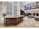 Elegant home bar with granite countertop and custom cabinetry at 2 Yorkridge Ct, Henderson, NV 89052