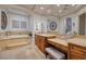 Spa-like bathroom with soaking tub and vanity at 2 Yorkridge Ct, Henderson, NV 89052