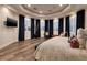 Bright bedroom with window seating and dark drapes at 2 Yorkridge Ct, Henderson, NV 89052