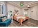 Charming bedroom with a comfortable bed, full-length mirror, and teal accent chair at 2 Yorkridge Ct, Henderson, NV 89052