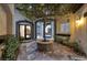 Peaceful courtyard with a tree and brick flooring at 2 Yorkridge Ct, Henderson, NV 89052