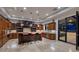 Spacious kitchen features island with seating, stainless steel appliances, and access to backyard at 2 Yorkridge Ct, Henderson, NV 89052
