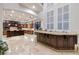 Gourmet kitchen boasts expansive island, custom cabinetry, and high-end appliances at 2 Yorkridge Ct, Henderson, NV 89052