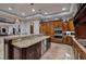 Modern kitchen with center island, stainless steel appliances, and custom cabinetry at 2 Yorkridge Ct, Henderson, NV 89052