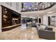 High ceiling living room with sectional sofa and pool view at 2 Yorkridge Ct, Henderson, NV 89052