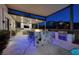 Granite island, built-in grill, and fire pit highlight this outdoor kitchen at 2 Yorkridge Ct, Henderson, NV 89052