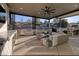 Covered patio with outdoor kitchen and seating area at 2 Yorkridge Ct, Henderson, NV 89052