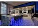 Stunning outdoor kitchen with granite counters, built-in grill, and fire pit at 2 Yorkridge Ct, Henderson, NV 89052