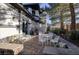 Charming patio with white iron furniture and landscaped garden at 2 Yorkridge Ct, Henderson, NV 89052