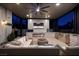 Relaxing patio with seating area, fireplace, and large TV at 2 Yorkridge Ct, Henderson, NV 89052