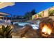 Stunning pool and spa with a waterfall feature and fire pit at 2 Yorkridge Ct, Henderson, NV 89052